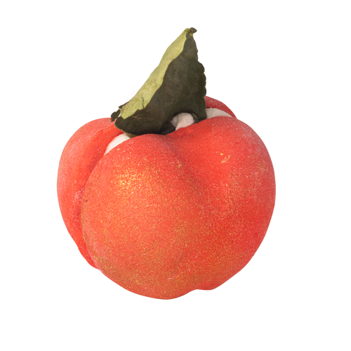 Apple Crumble. A red and shimmery gold, apple shaped, bubble bar. Split in two with a creamy filling and topped with a leaf.