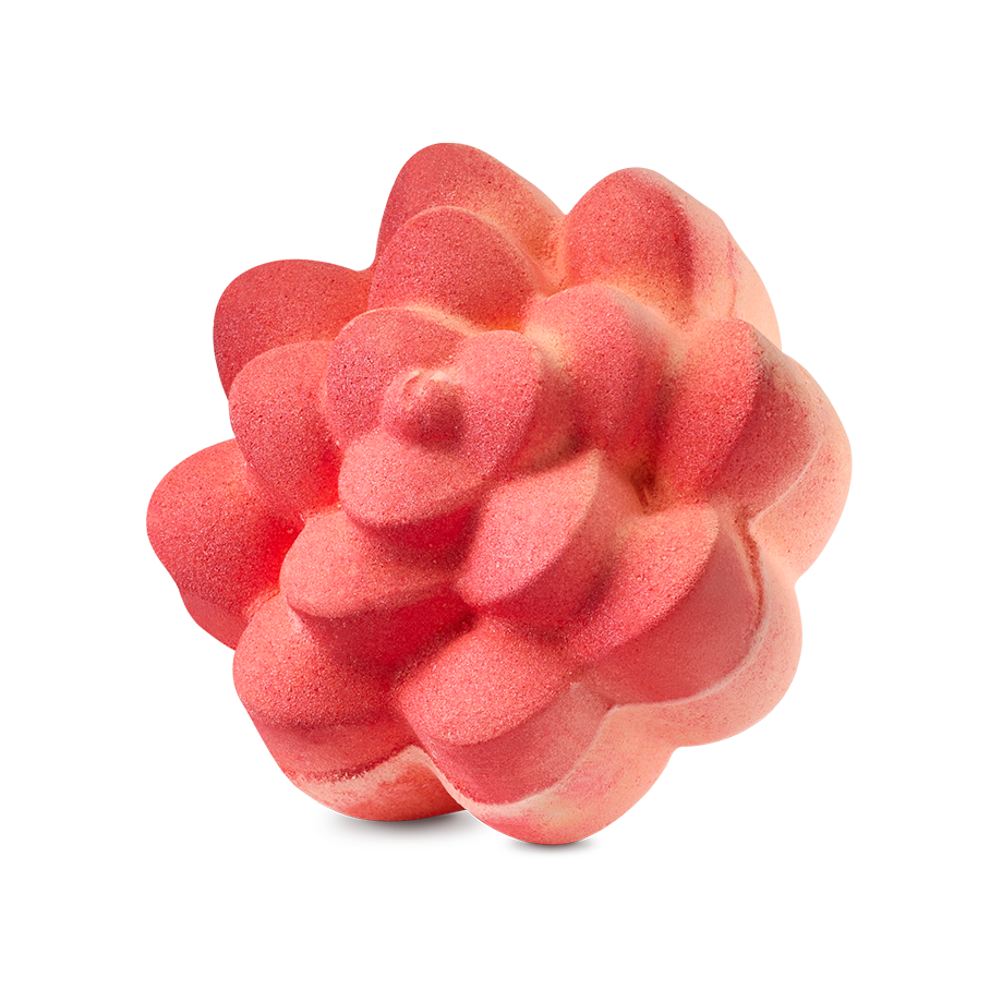 Comforter Rose. A vibrant coral-coloured bath bomb sculpted into the shape of a blooming rose with thick, rounded petals. The textured surface has a matte finish with subtle peach-coloured highlights.