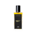 A glass perfume bottle filled with a light amber liquid. A black label reads 'The Perfume Library' and 'Hairdresser's Husband'.