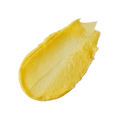 None of Your Beeswax. A neatly smeared swatch of thick, yellow honey-coloured lip balm with a slightly glossy finish.