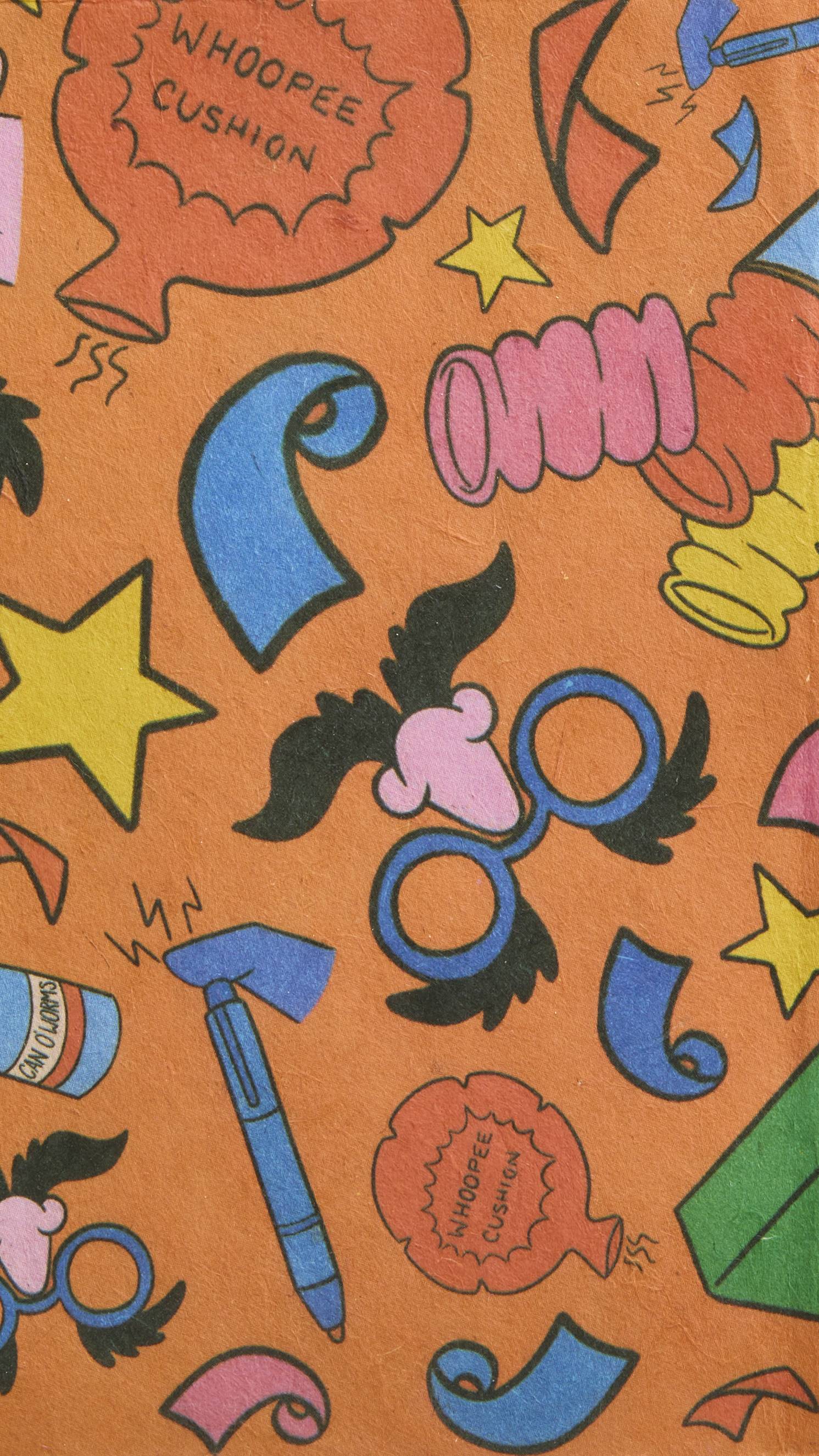 The image shows a s super close-up shot of the brightly coloured Practical Joker lokta paper wrap focusing on the textured surface of the material and crisp illustrations.