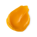 A swatch of thick, vibrant orange coloured Repeat foot balm.