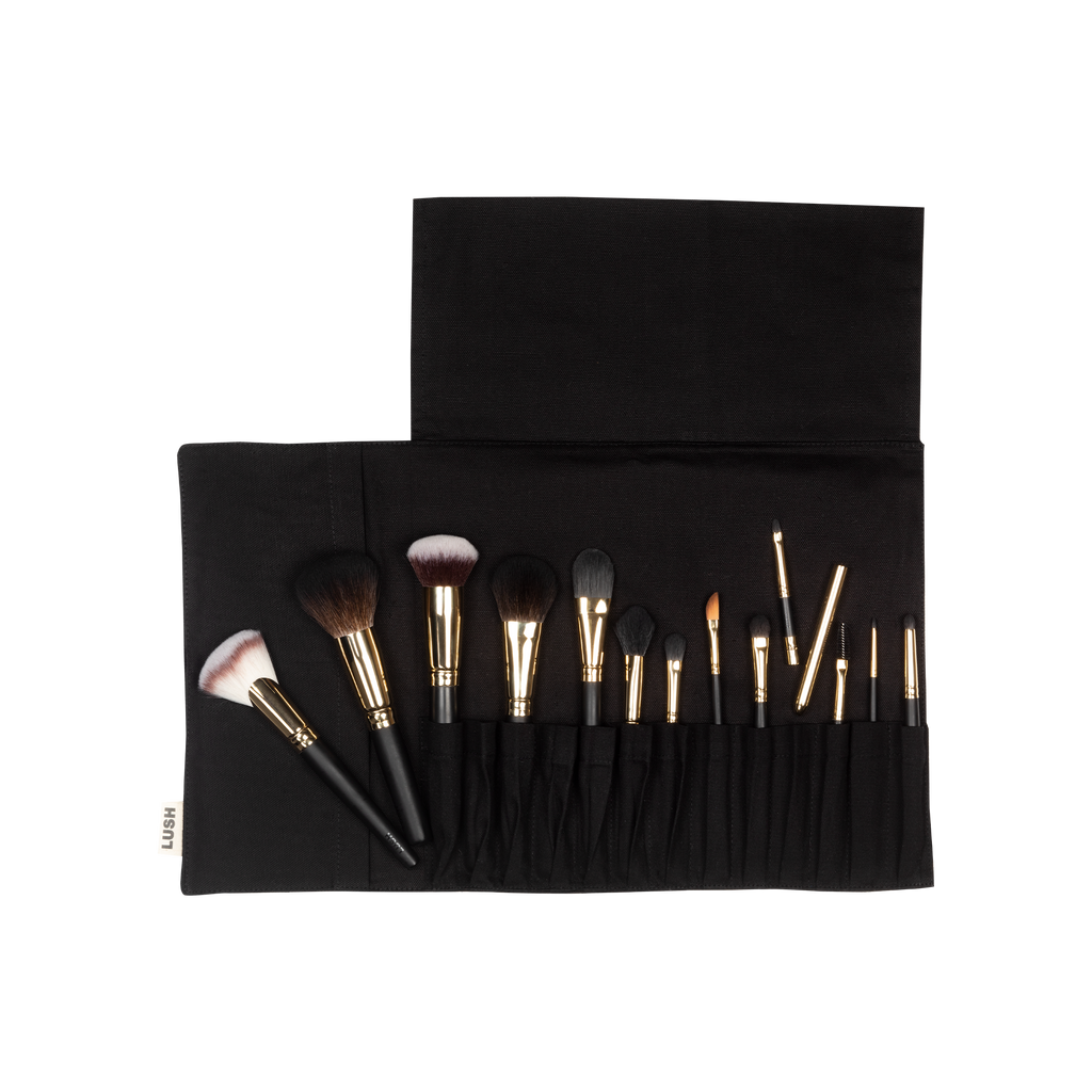 Roll With It Brush Set. A set of 13 handmade vegan make up brushes, wrapped up in a black, organic cotton storage wrap.